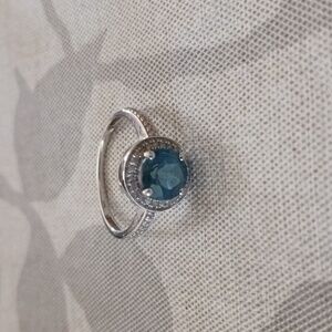 14 karat white gold beautiful London blue topaz and Diamond Halo ring size 7